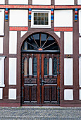 Entrance to a half-timbered house in Langenstrasse in Wiedenbrueck, Rheda-Wiedenbrueck, North Rhine-Westphalia, Germany