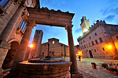 Fountain on town hall square at night, Montepulciano, South Tuscany, Tuscany, Italy