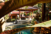 Woman reading in a pavilion, Ubud, Bali, Indonesia