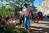 Market stall selling bananas and papayas outside the walls of Galle Fort, UNESCO world heritage, Galle, Southwest coast, Sri Lanka, South Asia