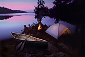 Campers watching sunset, Quetico Provencial Park, Canada