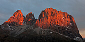 Grohmannspitze, Fuenffingerspitze, and Langkofel at sunrise seen from Sella Pass, Italy