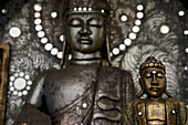 Wooden Buddhas in a shop, handicrafts in a shop east of Ubud, Bali, Indonesia