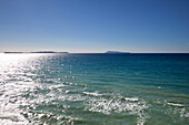 View across the sea at the rocky coast at Cape Drastis, near Peroulades, Sidari to the Diapontic islands, Corfu island, Ionian islands, Greece