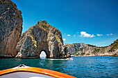 Boat at Faraglioni stacks, Capri, Bay of Naples, Campania, Italy