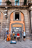 Street musicians in the old town of Naples, Bay of Naples, Campania, Italy