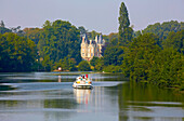 Houseboat on the river Sarthe and Chemire-sur-Sarthe castle, PK 90.5, Near Morannes, Dept. Maine-et-Loire, Region Pays de la Loire, France, Europe