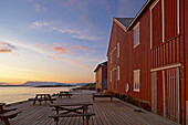 Red wooden house at Forvik ferry terminal, Vevelstad Sundet, Province of Nordland, Nordland, Norway, Europe