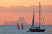 Sunset at Platja de ses Illetes and the rock Cala d'Hort of Ibiza, Formentera, Balearic Islands, Spain