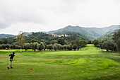 Person playing golf, golf course, province of Savona, Italian Riviera, Liguria, Italy