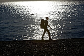 Woman hiking along long-distance footpath Lycian Way, Antalya, Turkey