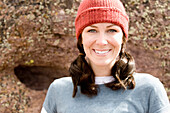 A woman wearing a red hat smiles into the camera Terrebone, Oregon, USA