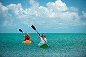 A man and woman kayak in Florida Key West, Florida, USA