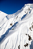 A male skier skis a big first descent in Haines, Alaska Haines, Alaska, USA