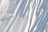A male skier skis a huge new first descent in Haines, Alaska Haines, Alaska, USA