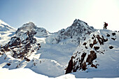 A skier posing on Heliotrope Ridge on Mount Baker, Washington Washington, USA