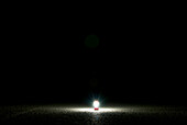 A red lantern lights up the dry desert ground in Ely, Nevada Ely, Nevada, USA
