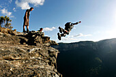 A BASE jumper performs a front flip off a cliff in the Blue Mountains, New South Wales, Australia Blue Mountains, New South Wales, Australia