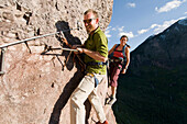 A man and woman rock climbing outside Telluride, Colorado Telluride, Colorado, USA