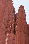 Man and woman rock climbers in the Fisher Towers, Utah Moab, Utah, USA