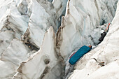 A woman sleeping in an icy crevasse, Mount Baker Wilderness, Bellingham, Washington Bellingham, Washington, USA