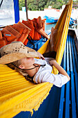 A woman relaxes in a hammock in Brazil Brazil