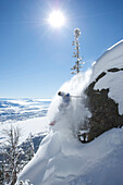 A man skis in powder snow in Wyoming Jackson, Wyoming, USA