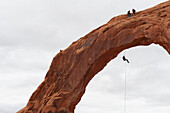 Rappelling off of the Carona Arch in Moab, UT Moab, Utah, USA