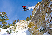 A skier catches some air off a large cliff at Snowbird, Utah, Utah, USA