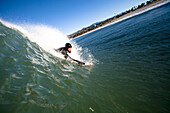 A male bodysurfer drops into a wave Ventura, California, United States of America