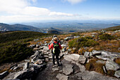 An athletic female hiker hikes the Franconia Ridge Trail Franconia, New Hampshire, United States of America