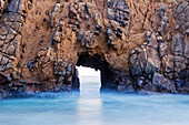 A sea arch at Pfeiffer Beach on the Big Sur coastline in California Big Sur, California, USA