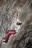 A man with white t shirt and red pants climbing in Jilotepec, Estado de Mexico, Mexico Not applicable, Estado de Mexico, Mexico