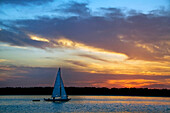 A sailboat at sunset on Hilton Head Island, South Carolina Hilton Head Island, South Carolina, USA