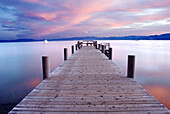 A pier at sunrise on the west shore of Lake Tahoe, California Lake Tahoe, California, USA