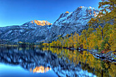 Fall colors and snow capped peaks line Silver Lake in the Eastern Sierra, California June Lake Loop, Eastern Sierra, California, USA