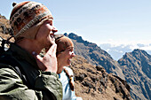 Two young people enjoy themselves on Dead Woman's Pass, Inca Trail Inca Trail, Andes Mountains, Peru