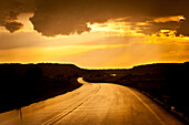 Road wet from a rain with stormy sky. La Junta, Colorado, United States La Junta, Colorado, United States