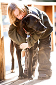 A boy poses with a dog in Lake Tahoe, California Truckee, CA, USA