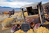 An old abandoned car sits permanently idle in the ghost town of Berlin, NV Berlin Ichthyosaur State Park, Nevada, USA
