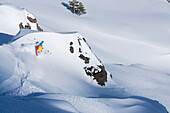 A man skiing powder snow at a ski resort in the Sierra mountains of California, California, usa