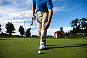 Man walking towards his golf ball Portland, Oregon, USA
