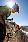 A man mountain biking with his dog Bend, Oregon, USA