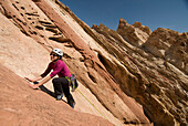 A woman rock climbing at the Reef, San Rafael Swell, Green River, Utah., Green River, Utah, usa