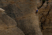 A woman climbing a rock arete in  Rocky Mountain National Park, Estes Park, Colorado., Estes Park, Colorado, usa