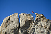 Climber jumping across a gap Bishop, California, United States