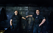 Oven in a smokehouse, from left Dietmar Lindemann and Joachim Thurow, oldest smokehouse in Vorpommern, Freest, Mecklenburg-Vorpommern, Germany