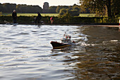 Model ship on a lake in the park, Hamburg, Germany