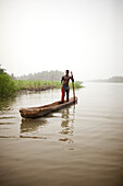 Man in a logboat fishing on Mono river, Agbanakin, near Grand-Popo, Mono Department, Benin