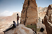 Priest students on a rock, monolithic church Abuna Yemata Guh, Hawzien, Tigray Region, Ethiopia